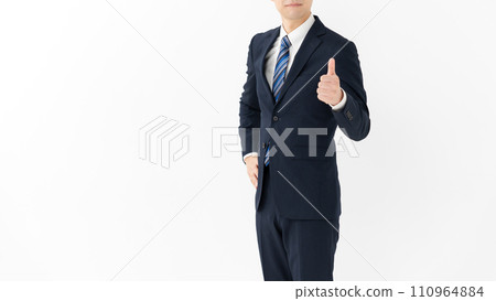 A businessman doing a good sign A businessman doing a good sign 110964884