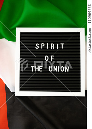Text SPIRIT OF THE UNION on background flag of UAE. National holiday of United Arab Emirates. Commemoration Day Muslim Arabian holidays. Dubai 110964888