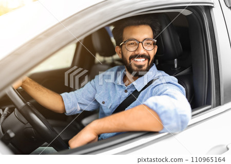 Photo of wealthy eastern businessman in casual driving nice car, 110965164