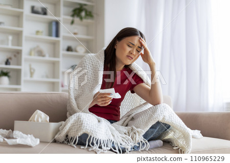 Seasonal Flu. Sick Woman Covered In Blanket Sitting On Couch At Home 110965229