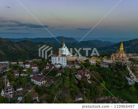 .Aerial view White buddha in Wat Phra That Pha Son Kaew temple at sunset. 110968497