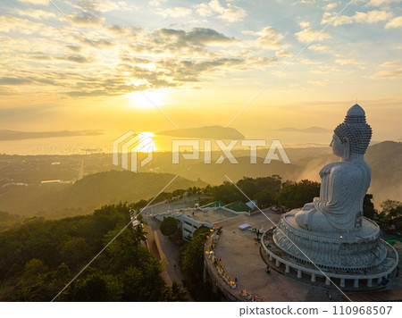 aerial view yellow cloud in sunrise behind Phuket big Buddha. aerial view yellow cloud in sunrise behind Phuket big Buddha. 110968507