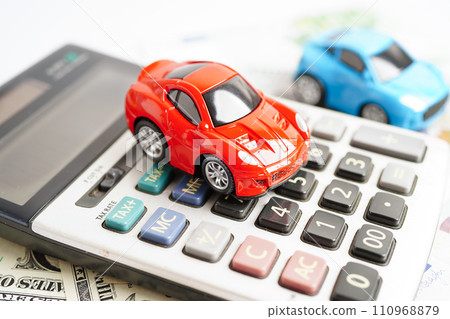 Bangkok, Thailand November 18, 2023 Car on banknote money with calculator, buying or insurance concept. 110968879