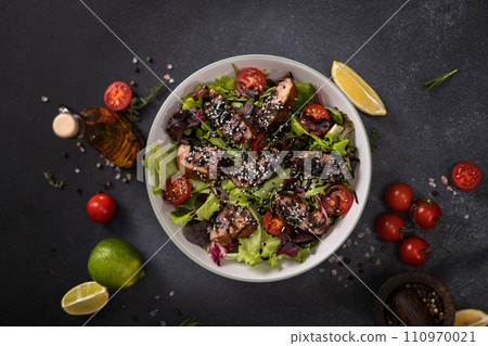 tuna steak salad with sesame seeds and teriyaki sauce in a ceramic bowl tuna steak salad with sesame seeds and teriyaki sauce in a ceramic bowl 110970021