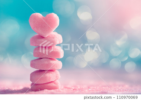 Closeup of pink candy hearts and sweets in shape of love symbol on pink background, for Valentine's day Closeup of pink candy hearts and sweets in shape of love symbol on pink background, for Valentine's day 110970069