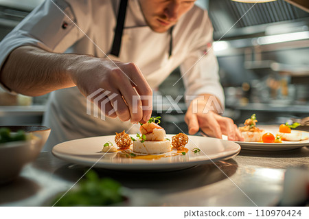 Chef Garnishing a Gourmet Dish in Kitchen Chef Garnishing a Gourmet Dish in Kitchen 110970424