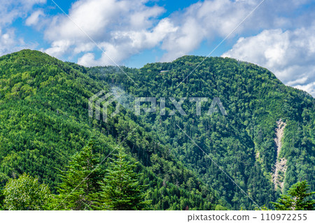 Climbing Mt. Shiomi, Japan's 100 Famous Mountains in Shizuoka Prefecture - Sanpuku Pass Hut seen from Mt. Hontani 110972255