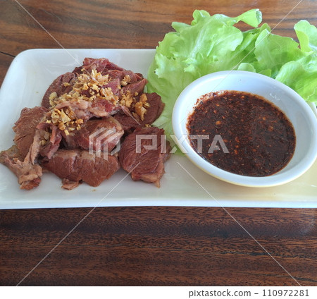 Braised pork with salad vegetables, and sauce. Braised pork with salad vegetables, and sauce. 110972281