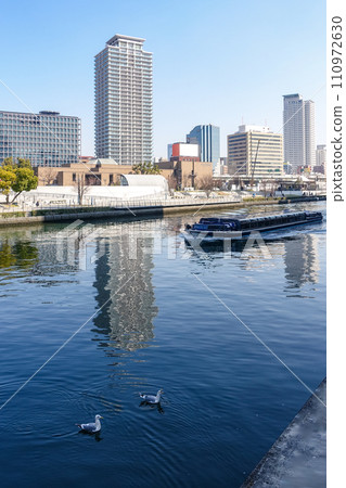 Osaka townscape along the Tosabori River from Sendanki Bridge Osaka townscape along the Tosabori River from Sendanki Bridge 110972630