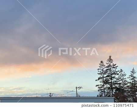 Clouds in the winter evening sky Clouds in the winter evening sky 110975471