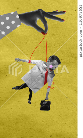 Young man hanging on string that female hand holding. Manipulation and control. Contemporary art collage. 110975653