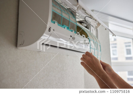 Dirty air conditioner filter need cleaning. Air conditioner service, repair and clean equipment. Dirty air conditioner filter need cleaning. Air conditioner service, repair and clean equipment. 110975816