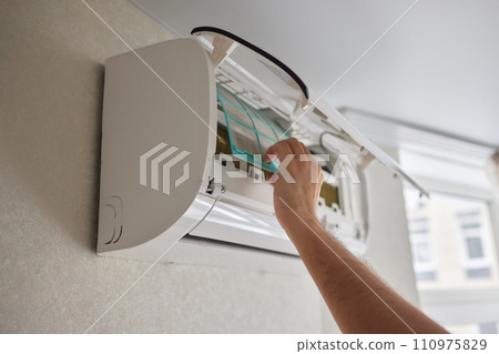 Dirty air conditioner filter need cleaning. Air conditioner service, repair and clean equipment. 110975829