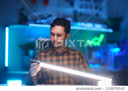 Compact, portable mini LED lamp isolated on a bright background. 110976545