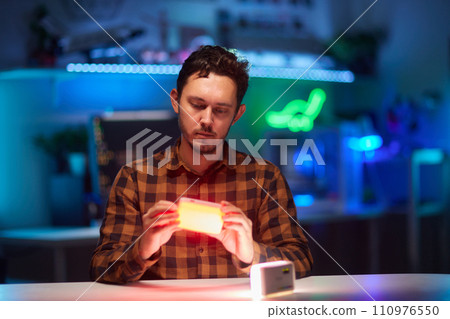 Compact, portable mini LED lamp isolated on a bright background. Compact, portable mini LED lamp isolated on a bright background. 110976550