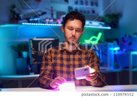 Compact, portable mini LED lamp isolated on a bright background. 110976552