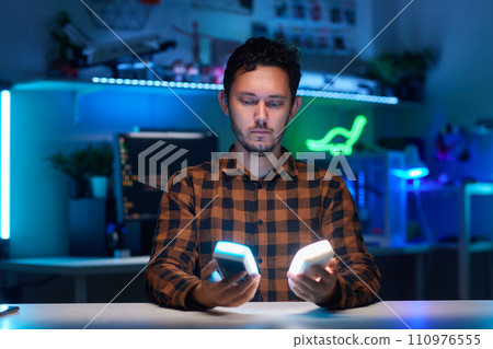 Compact, portable mini LED lamp isolated on a bright background. Compact, portable mini LED lamp isolated on a bright background. 110976555