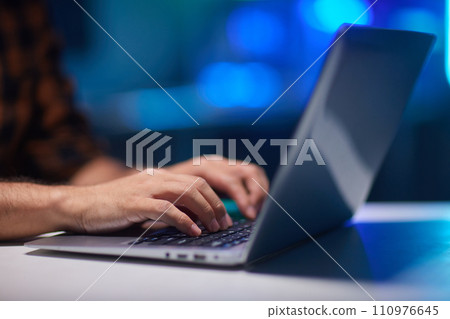 Young man using laptop in room at home 110976645