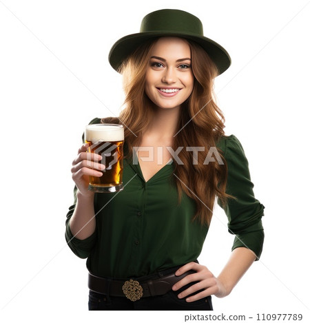 A girl in green clothes with a mug of beer. St. Patrick's Day celebration 110977789