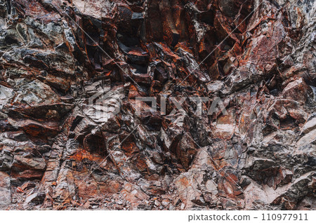 texture of orange stone mountain with natural minerals in close-up texture of orange stone mountain with natural minerals in close-up 110977911