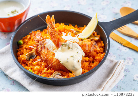 Chicken rice topped with fried shrimp Chicken rice topped with fried shrimp 110978222
