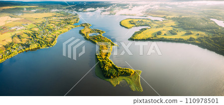 Lyepyel District, Lepel Lake, Beloozerny District, Vitebsk Region. Aerial View Of Residential Area With Houses In Countryside. Top View Of Island From High Attitude In Autumn Morning. Bird's Eye View 110978501