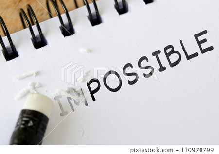 Pencil eraser erasing impossible into possible. Motivational and inspirational concept 110978799