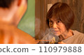 Senior woman having dinner with her parent and child 110979888