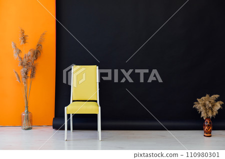 Yellow chair in black orange room interior Yellow chair in black orange room interior 110980301