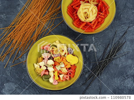 Bowl with raw pasta on cooking table Bowl with raw pasta on cooking table 110980578