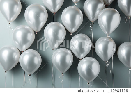 Silver metallic helium balloons on grey background Silver metallic helium balloons on grey background 110981118