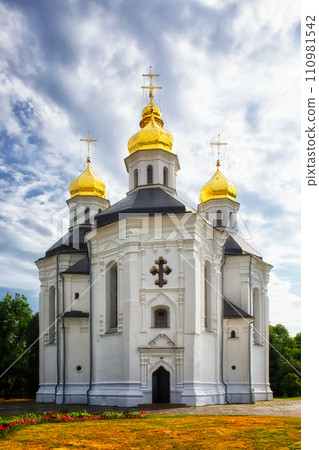 The Catherine's Church, with its white exterior and five resplendent golden domes, rises gracefully against the serene backdrop, showcasing the distinctive qualities of Ukrainian Baroque architecture. 110981542