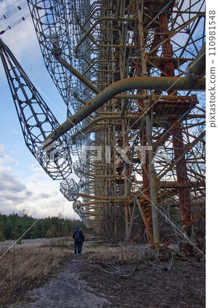A complex steel edifice stands tall amidst dry grasses, contrasting the soft clouds in the sky above. Duga is a Soviet over-the-horizon radar station for an early detection system for ICBM launches. A complex steel edifice stands tall amidst dry grasses, contrasting the soft clouds in the sky above. Duga is a Soviet over-the-horizon radar station for an early detection system for ICBM launches. 110981548