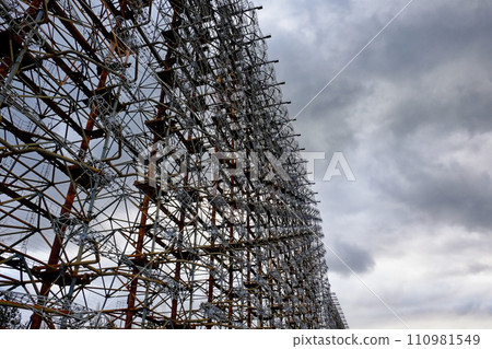 Rusty structures filled with a web of cables and wires. Duga is a Soviet over-the-horizon radar station for an early detection system for ICBM launches. Rusty structures filled with a web of cables and wires. Duga is a Soviet over-the-horizon radar station for an early detection system for ICBM launches. 110981549