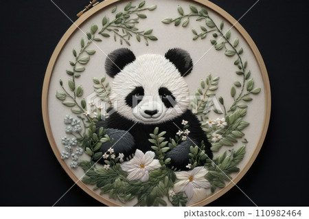 Embroidery of little panda among plants and flowers in round frame Embroidery of little panda among plants and flowers in round frame 110982464