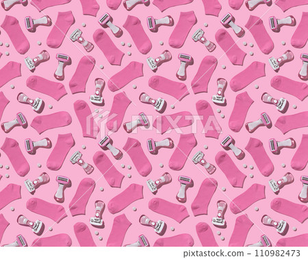 Pattern of pink socks and women's razors on pink background. Joky set for March 8 110982473