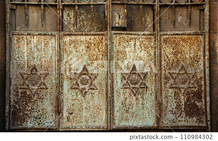Fragment of old doors of a historical jerusalem building with Stars of David Fragment of old doors of a historical jerusalem building with Stars of David 110984302
