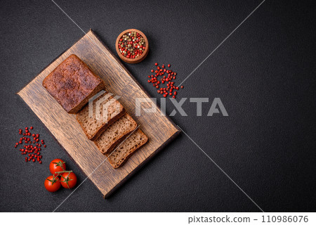 Delicious fresh crispy brown bread with seeds and grains Delicious fresh crispy brown bread with seeds and grains 110986076