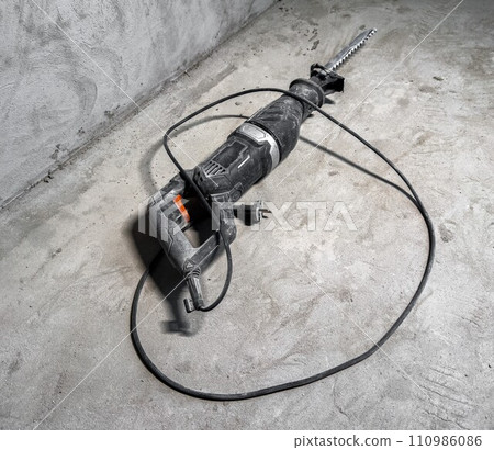 Perforator at construction site. Puncher, power drill, building tool 110986086