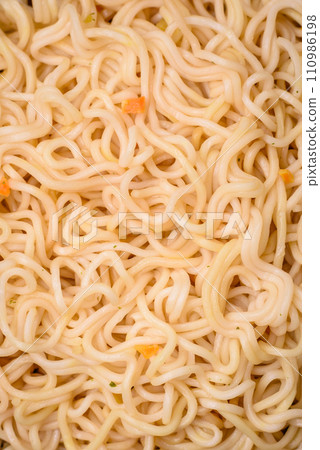 Delicious Asian cuisine dish with rice noodles, peppers, mushrooms and spices Delicious Asian cuisine dish with rice noodles, peppers, mushrooms and spices 110986198
