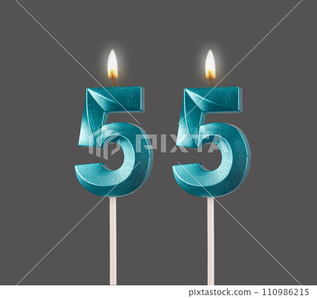 55 birthday, number candles with light, isolated on white background 55 birthday, number candles with light, isolated on white background 110986215
