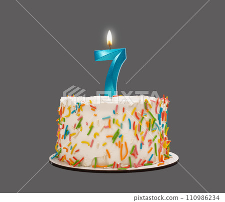 7 shaped candle light on happy birthday cake isolated on white background 7 shaped candle light on happy birthday cake isolated on white background 110986234