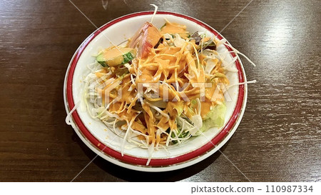 Salad with Indian/Nepalese dressing 110987334
