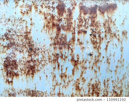 Rusty metal background with streaks of rust. Corroded metal background. Rust stains. Rusty corrosion. 110991192