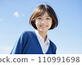 High school girl smiling healthy against the blue sky AI generated 110991698