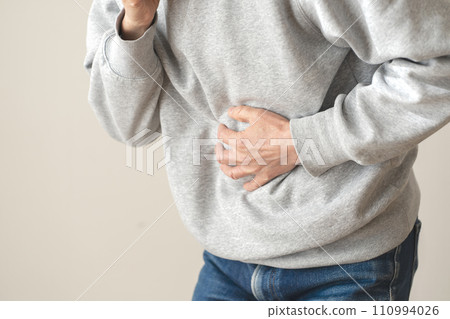 Man with abdominal pain body parts 110994026