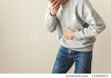 Man with abdominal pain body parts 110994037