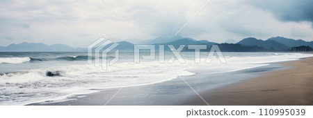 Sandy beach in nasty weather with big waves, stormy sea landscape with copyspace 110995039