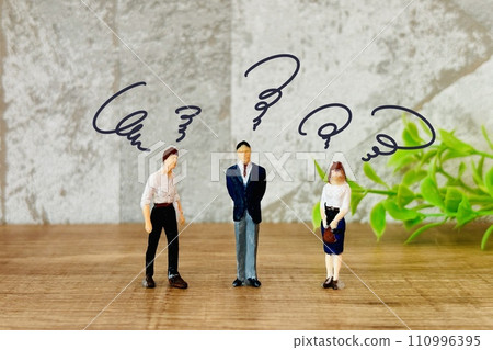 Businessmen who are worried 110996395