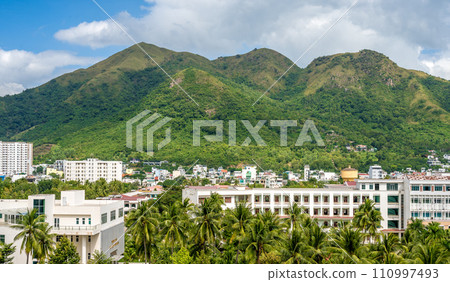 Nha Trang cityscape, combining traditional charm with modernity. mountain skyline capture dynamic spirit of this Vietnamese gem 110997493